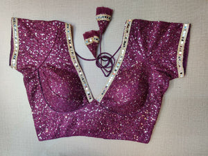 Shop beautiful purple sequin saree blouse online in USA with mirror work lace. Elevate your Indian ethnic saree looks with beautiful readymade sari blouse, embroidered saree blouses, Banarasi saree blouse, designer saree blouses, sleeveless saree blouses from Pure Elegance Indian fashion store in USA.-front