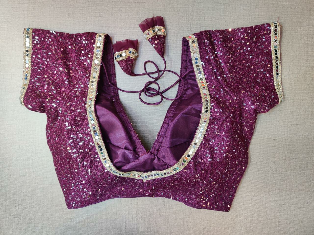 Shop beautiful purple sequin saree blouse online in USA with mirror work lace. Elevate your Indian ethnic saree looks with beautiful readymade sari blouse, embroidered saree blouses, Banarasi saree blouse, designer saree blouses, sleeveless saree blouses from Pure Elegance Indian fashion store in USA.-back