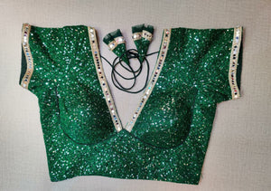 Buy stunning bottle green sequin saree blouse online in USA with mirror work lace. Elevate your Indian ethnic saree looks with beautiful readymade sari blouse, embroidered saree blouses, Banarasi saree blouse, designer saree blouses, sleeveless saree blouses from Pure Elegance Indian fashion store in USA.-front