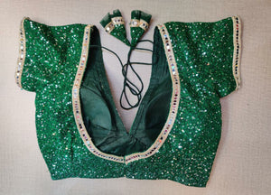 Buy stunning bottle green sequin saree blouse online in USA with mirror work lace. Elevate your Indian ethnic saree looks with beautiful readymade sari blouse, embroidered saree blouses, Banarasi saree blouse, designer saree blouses, sleeveless saree blouses from Pure Elegance Indian fashion store in USA.-back