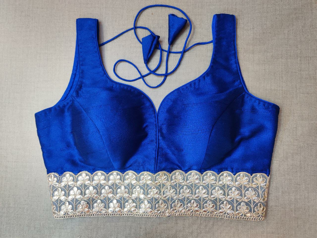 Buy stunning royal blue embroidered sleeveless saree blouse online in USA. Elevate your Indian ethnic saree looks with beautiful readymade saree blouse, embroidered saree blouses, Banarasi saree blouse, designer sari blouses, sleeveless saree blouses from Pure Elegance Indian fashion store in USA.-front