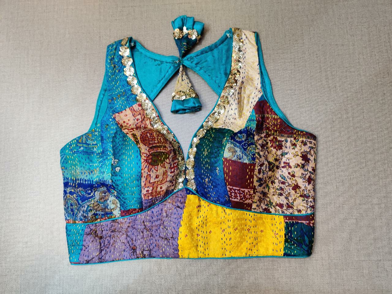 Shop stunning blue multicolor patch sleeveless saree blouse online in USA with Kantha stitch. Elevate your Indian ethnic saree looks with beautiful readymade saree blouse, embroidered saree blouses, Banarasi saree blouse, designer sari blouses, sleeveless saree blouses from Pure Elegance Indian fashion store in USA.-front