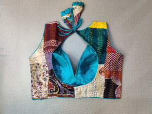 Shop stunning blue multicolor patch sleeveless saree blouse online in USA with Kantha stitch. Elevate your Indian ethnic saree looks with beautiful readymade saree blouse, embroidered saree blouses, Banarasi saree blouse, designer sari blouses, sleeveless saree blouses from Pure Elegance Indian fashion store in USA.-back