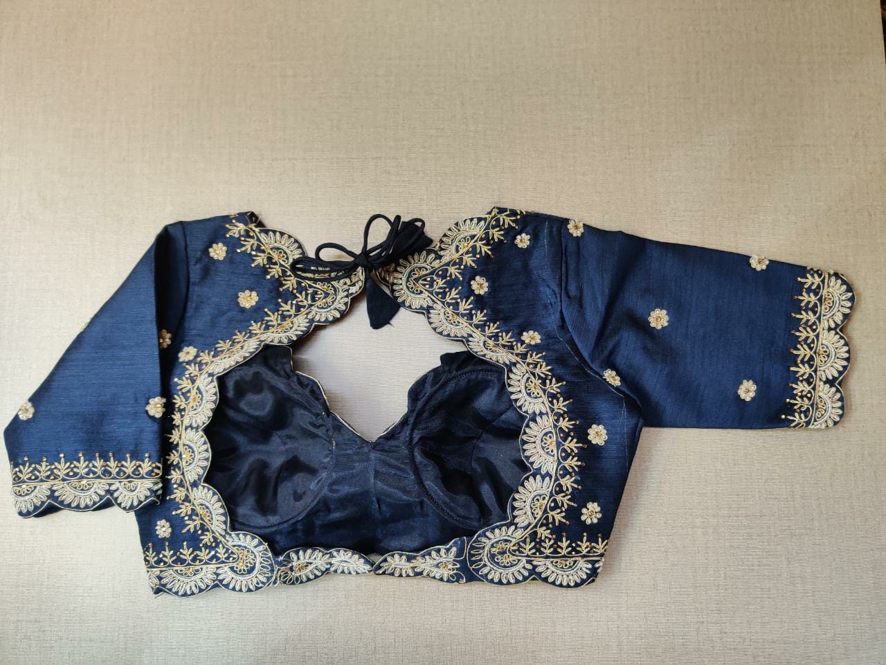 Buy beautiful dark blue embroidered saree blouse online in USA. Elevate your Indian ethnic saree looks with beautiful readymade saree blouse, embroidered saree blouses, Banarasi saree blouse, designer sari blouses, sleeveless saree blouses from Pure Elegance Indian fashion store in USA.-back