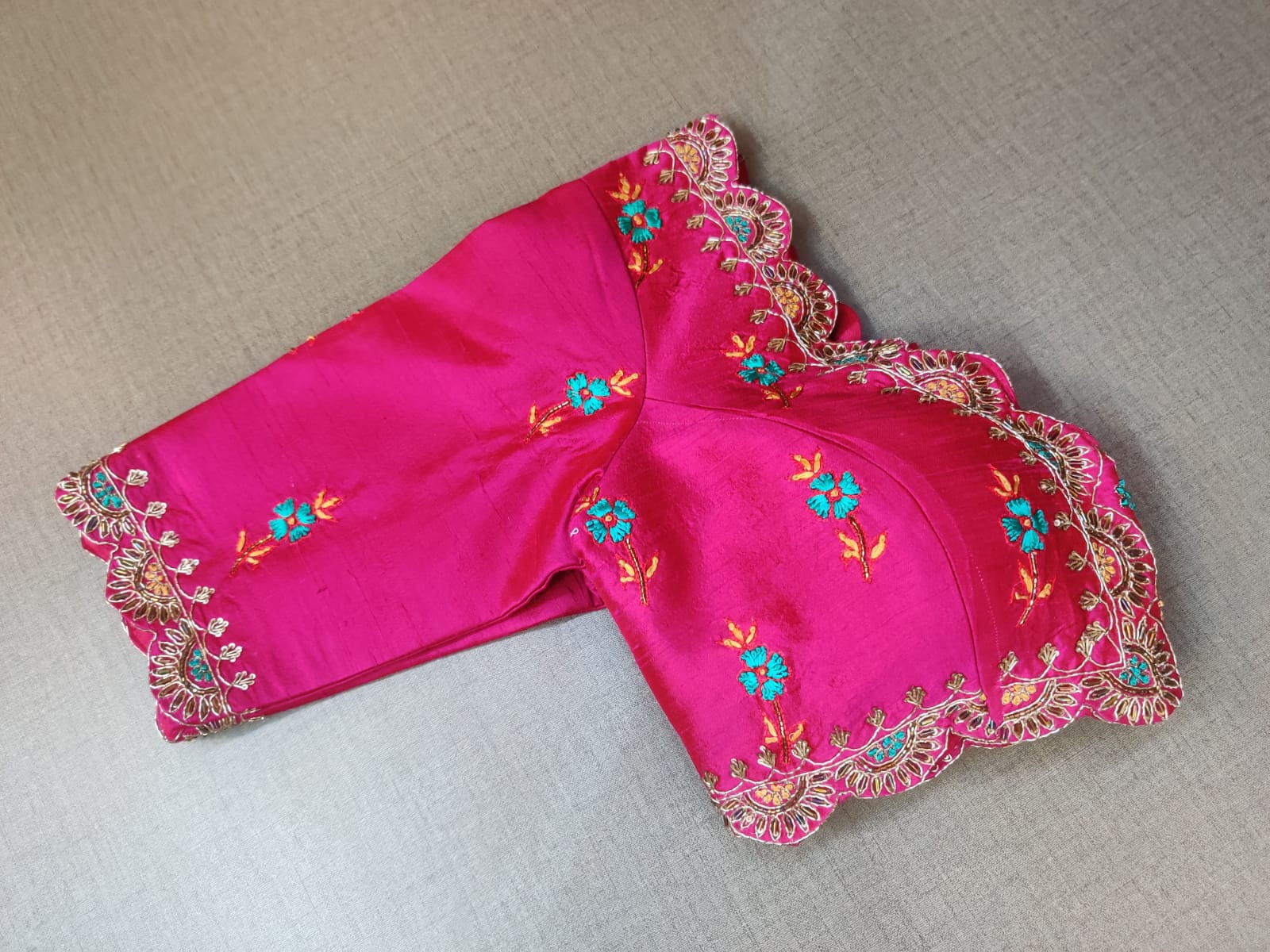 Shop stunning fuschia pink embroidered designer saree blouse online in USA. Elevate your Indian ethnic saree looks with beautiful readymade saree blouse, embroidered saree blouses, Banarasi saree blouse, designer sari blouses, sleeveless saree blouses from Pure Elegance Indian fashion store in USA.-sleeves
