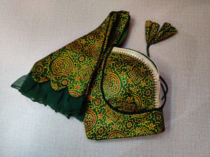 Shop beautiful mehendi green Ajrakh saree blouse online in USA with frill sleeves. Elevate your Indian ethnic saree looks with beautiful readymade saree blouse, embroidered saree blouses, Banarasi saree blouse, designer sari blouses, sleeveless saree blouses from Pure Elegance Indian fashion store in USA.-sleeves