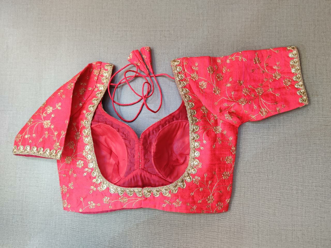 Buy stylish pink embroidered designer ready made saree blouse in raw silk online in USA. Adorned in floral jaal pattern designer sari blouse, blouse in raw silk with sweetheart cut neckline, long sleeves, designer sari blouses online, raw silk fabric, sari blouses from Pure Elegance Indian fashion store in USA.- Back.