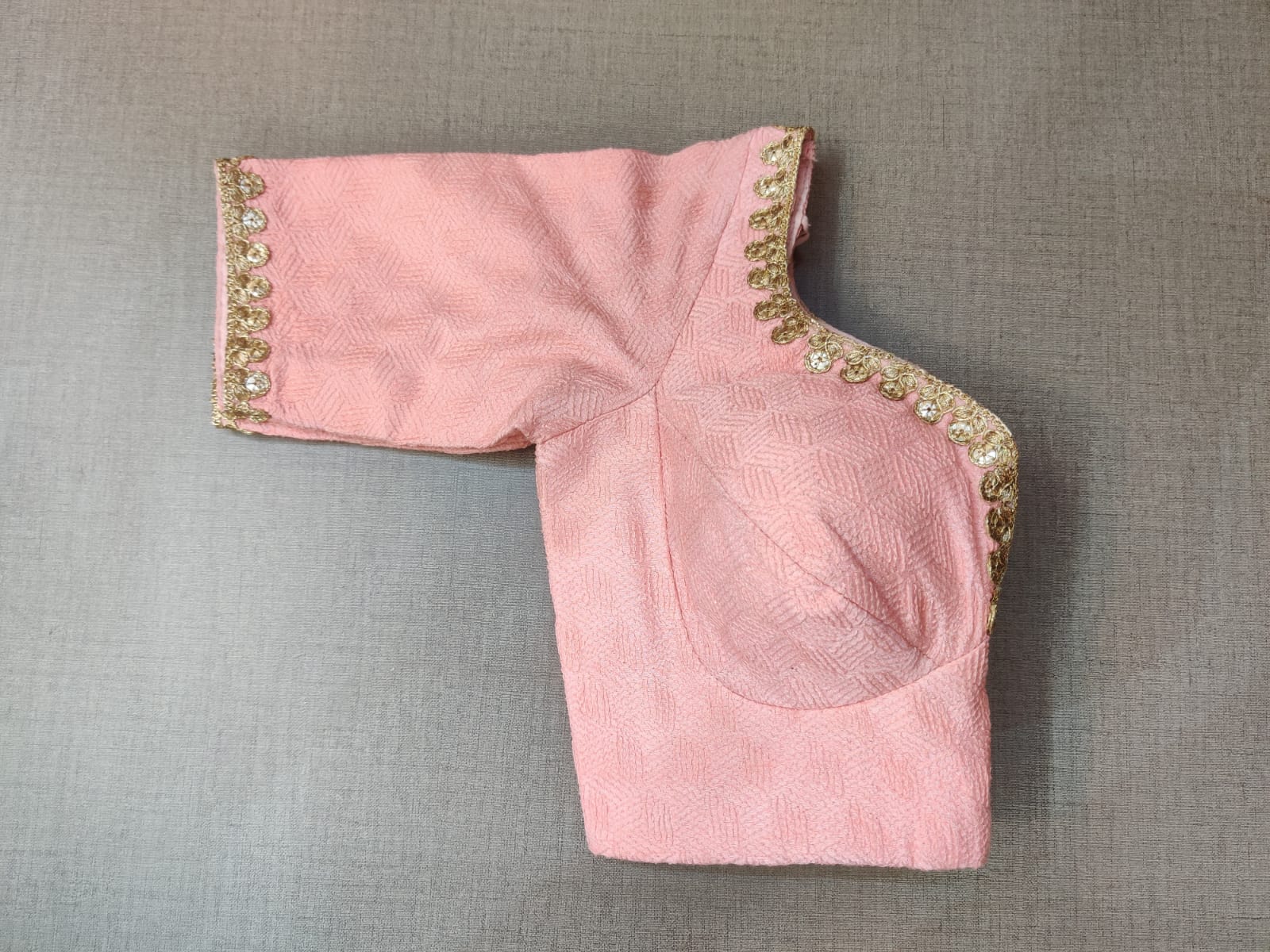 Buy rose pink ready made saree blouse with beautiful golden lace border online in USA. Crafted with beautiful golden lace border and dori ties, designer sari blouse, saree blouse with sweetheart cut neckline, long sleeves, designer sari blouses online, sari blouses from Pure Elegance Indian fashion store in USA.- Sleeve.