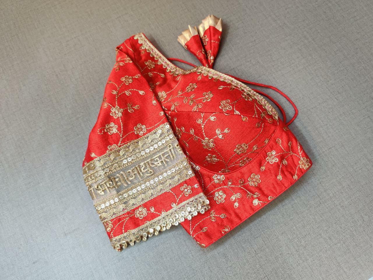 Buy Red and gold-coloured embroidered saree blouse has a deep neck, floral and back open with hook online in USA. Pair this fancy designer sari blouse crafted with beautiful golden lace border, dori ties with ethnic sari, designer saree blouses online, sari blouses from Pure Elegance Indian fashion store in USA.- Sleeve.