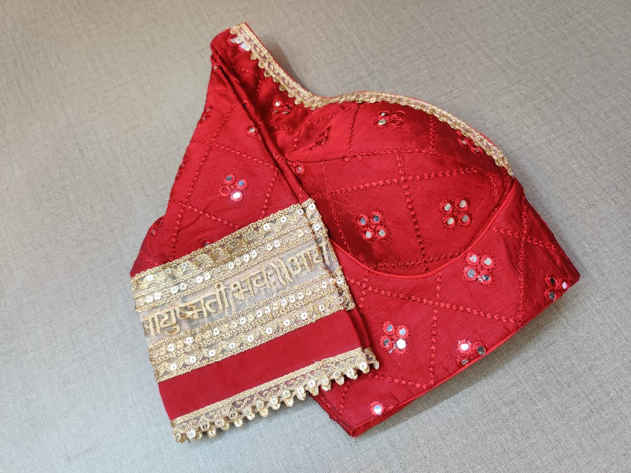 Buy this dark red embroidered saree blouse in online in USA. Showoff this fancy designer sari blouse with V-neck,long sleeves crafted with beautiful golden lace border, dori ties with ethnic sari, long sleeves, designer saree blouses online, raw silk sari blouses from Pure Elegance Indian fashion store in USA.- Sleeve.