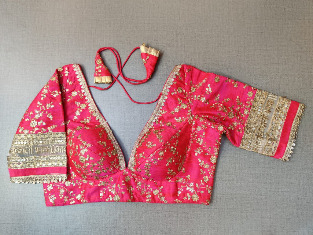 Buy elegant rani pink embroidered designer saree blouse with golden lace mantra border in online in USA. Pair this  exquisite designer sari blouse crafted with floral jaal pattern, dori ties, with ethnic sari, long sleeves, sari designer sari blouse online, sari blouses from Pure Elegance Indian fashion store in USA.- Front.