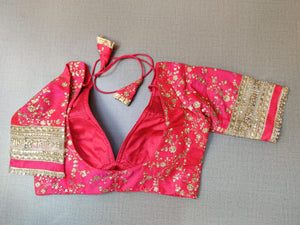 Buy elegant rani pink embroidered designer saree blouse with golden lace mantra border in online in USA. Pair this  exquisite designer sari blouse crafted with floral jaal pattern, dori ties, with ethnic sari, long sleeves, sari designer sari blouse online, sari blouses from Pure Elegance Indian fashion store in USA.- Back.