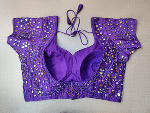 Buy elegant violet designer saree blouse with beautiful mirror work in online in USA. Pair this  exquisite designer sari blouse crafted with mirror work and sweetheart neckline, dori ties, with ethnic sari, short sleeves, sari designer sari blouse online, sari blouses from Pure Elegance Indian fashion store in USA.- Back.