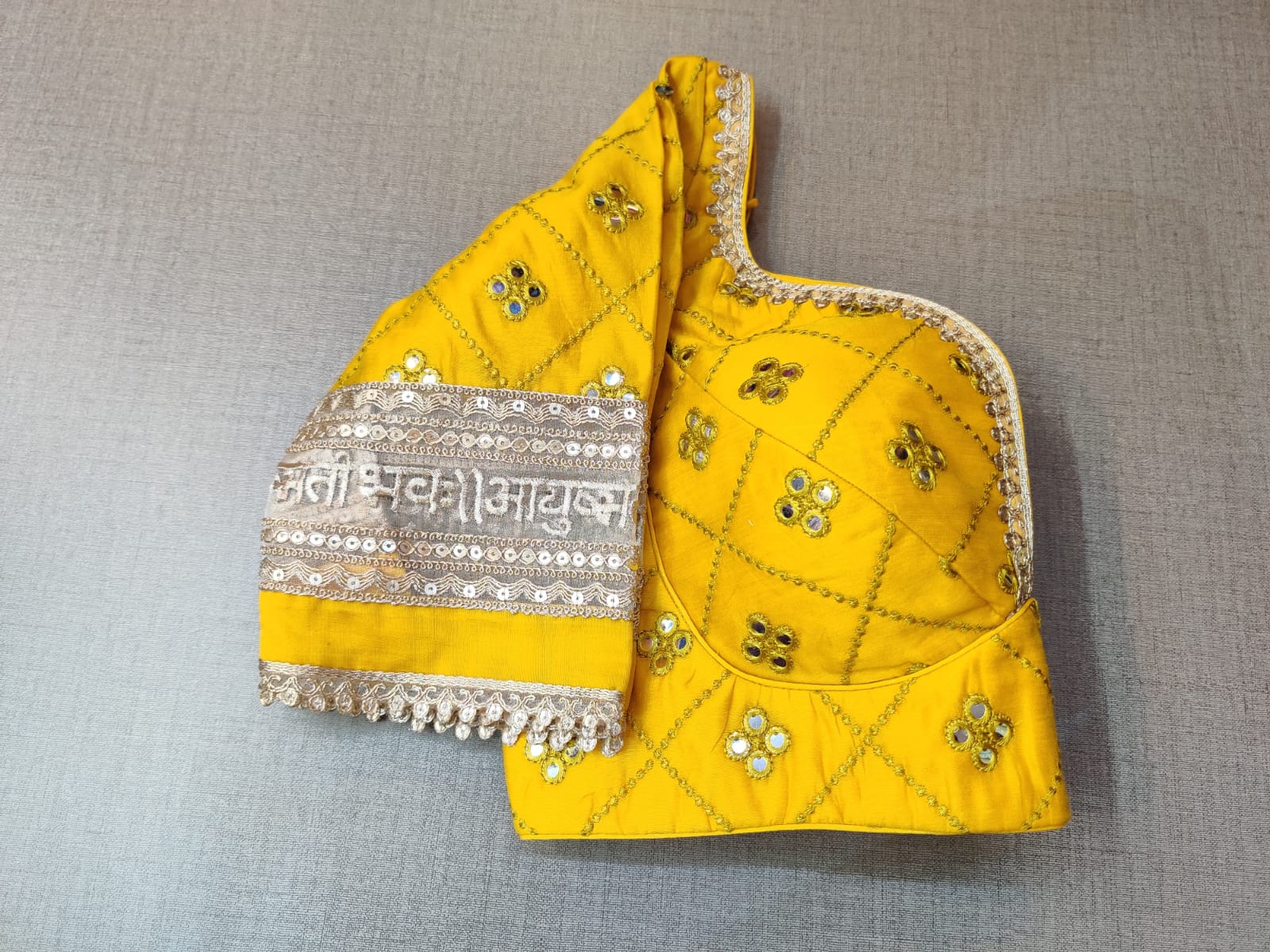 Buy this exquisite yellow designer saree blouse online with mirror work in USA. Add yellow embroidered designer saree blouse with mirror work and mantra lace border with sweetheart neckline, long sleeve, banarasi sari blouse, sari blouses online, sari blouse from Pure Elegance Indian fashion store in USA.- Sleeve.