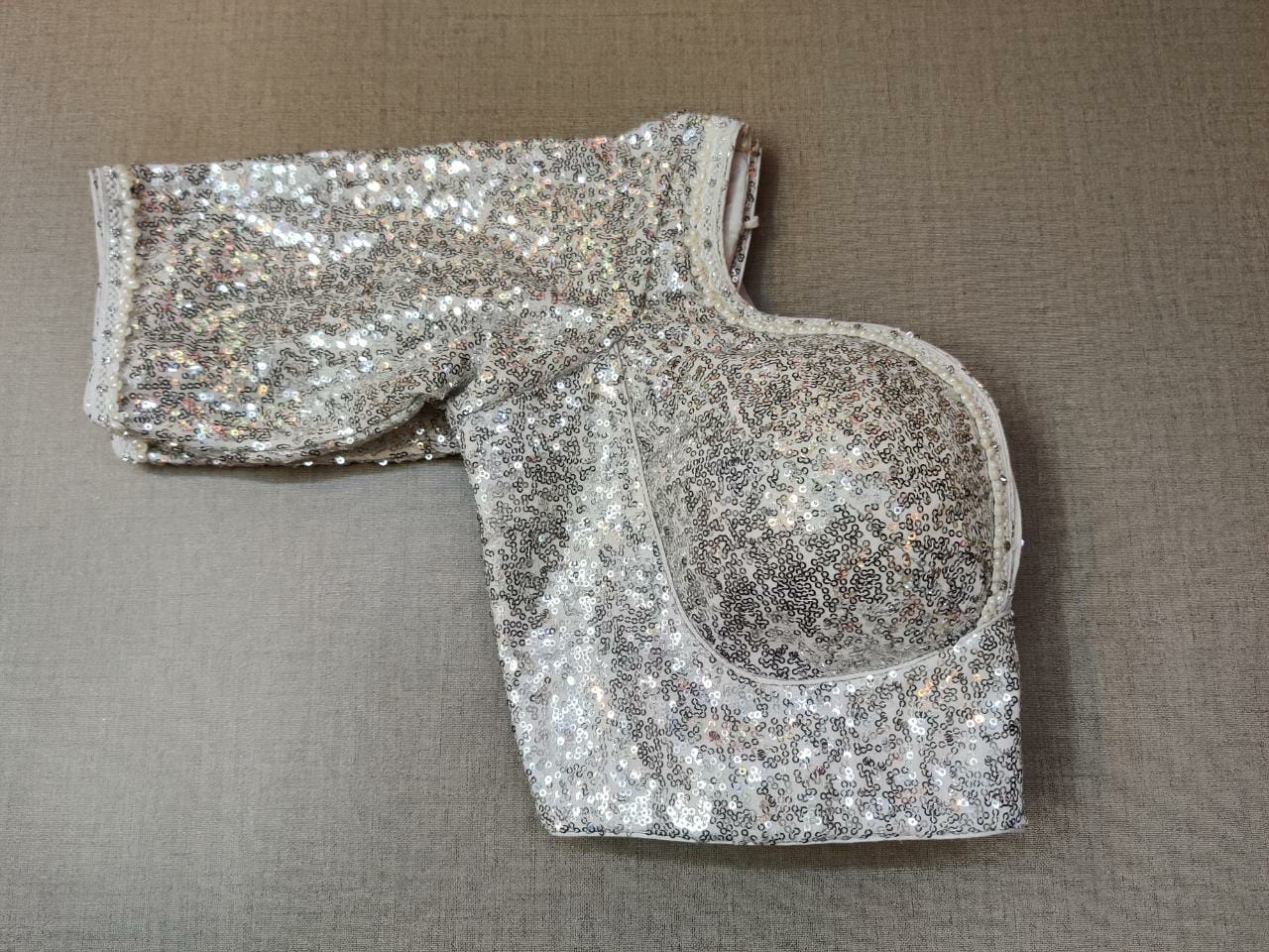 Buy this exquisite silver sequin designer saree blouse online in USA. This blouse is the perfect fit for your festive outift needs. Enjoy a comfortable day ahead with the carefully crafted grey fabric with sweetheart neckline, long sleeve, sari blouses online, sari blouse from Pure Elegance Indian fashion store in USA.- Sleeve.