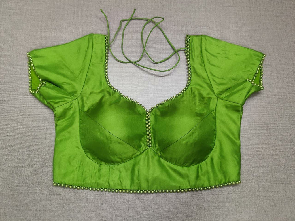 Shop this fashionable blouse which has dori ties with a beautiful printed sari and statement neck piece and your are good to go! Fabric : Silk ; Color : Lime Green ; Sleeves : Short Sleeve ; Pattern : Padded ; Deep ''U'' Neck ; Pattern : Solid; Occasion : Casual wear, Festive Wear. Buy designer sari blouse from Pure Elegance Indian fashion store in USA.-Front view.