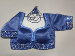 Buy this exquisite blue silk designer saree blouse with mirror work online in USA. This blouse is the perfect fit for your festive outfit needs. Enjoy a comfortable day ahead with the carefully crafted silk fabric with sweetheart neckline, long sleeve, sari blouses online, sari blouse from Pure Elegance Indian fashion store in USA.-Front view.
