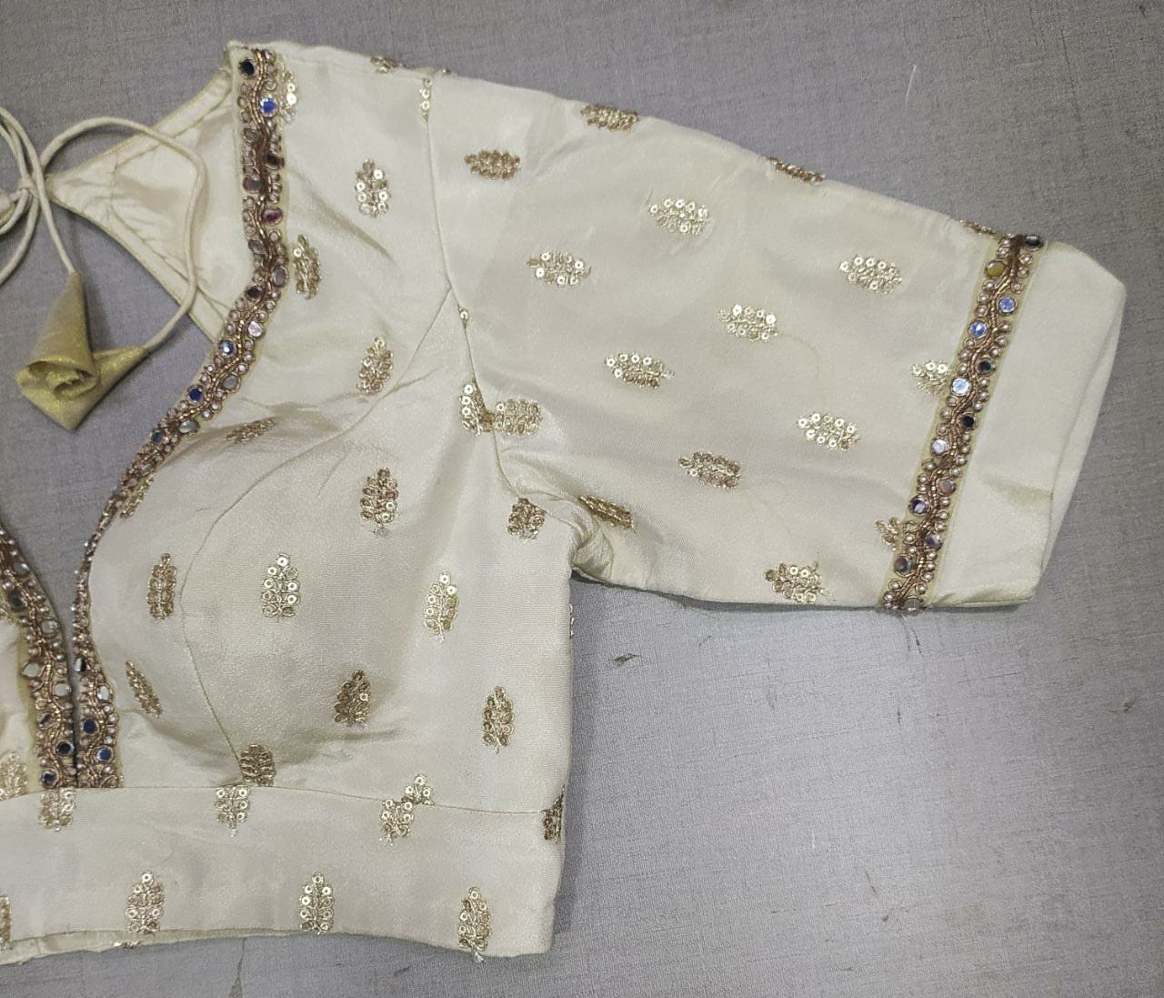 Shop cream saree blouse online in USA with embroidered motifs. Elevate your Indian ethnic sarees with beautiful readymade sari blouses, embroidered saree blouses, Banarasi saree blouse, designer sari blouses, choli-cut blouses from Pure Elegance Indian fashion store in USA.-sleeves
