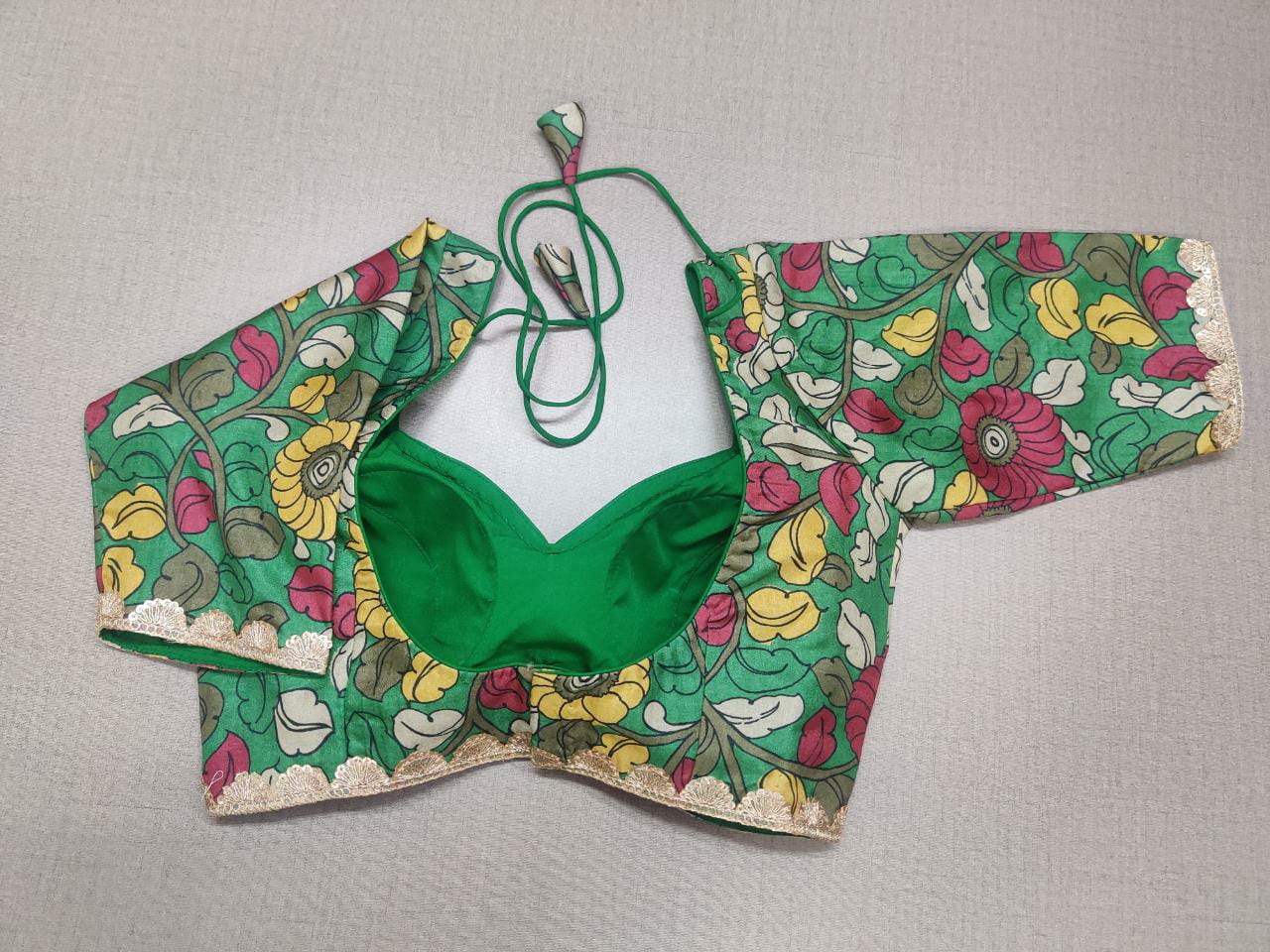 Buy stunning green Kalamkari print saree blouse online in USA. Elevate your Indian ethnic sarees with beautiful readymade sari blouses, embroidered saree blouses, Banarasi saree blouse, designer sari blouses, choli-cut blouses from Pure Elegance Indian fashion store in USA.-back