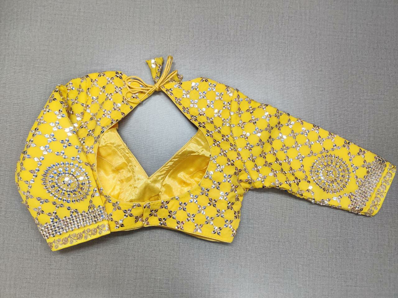 Shop stunning yellow heavy embroidery saree blouse online in USA. Elevate your Indian ethnic sarees with beautiful readymade sari blouses, embroidered saree blouses, Banarasi saree blouse, designer sari blouses, choli-cut blouses from Pure Elegance Indian fashion store in USA.-back