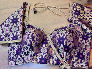 Shop gorgeous purple Banarsi silk saree blouse online in USA with golden lace. Elevate your ethnic saree style with a tasteful collection of designer saree blouses, embroidered sari blouses, Banarasi blouses, silk saree blouses from Pure Elegance Indian clothing store in USA.-front