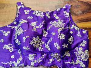 Buy stunning purple embroidered sleeveless saree blouse online in USA. Elevate your ethnic saree style with a tasteful collection of designer saree blouses, embroidered sari blouses, Banarasi blouses, silk saree blouses from Pure Elegance Indian clothing store in USA.-front