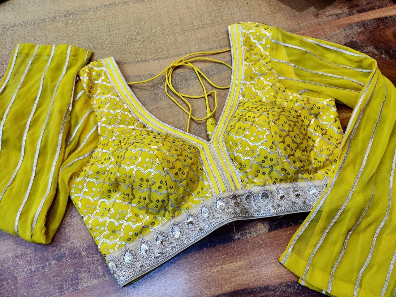 Shop stunning yellow embroidered designer sari blouse online in USA. Elevate your ethnic saree style with a tasteful collection of designer saree blouses, embroidered sari blouses, Banarasi blouses, silk saree blouses from Pure Elegance Indian clothing store in USA.-front