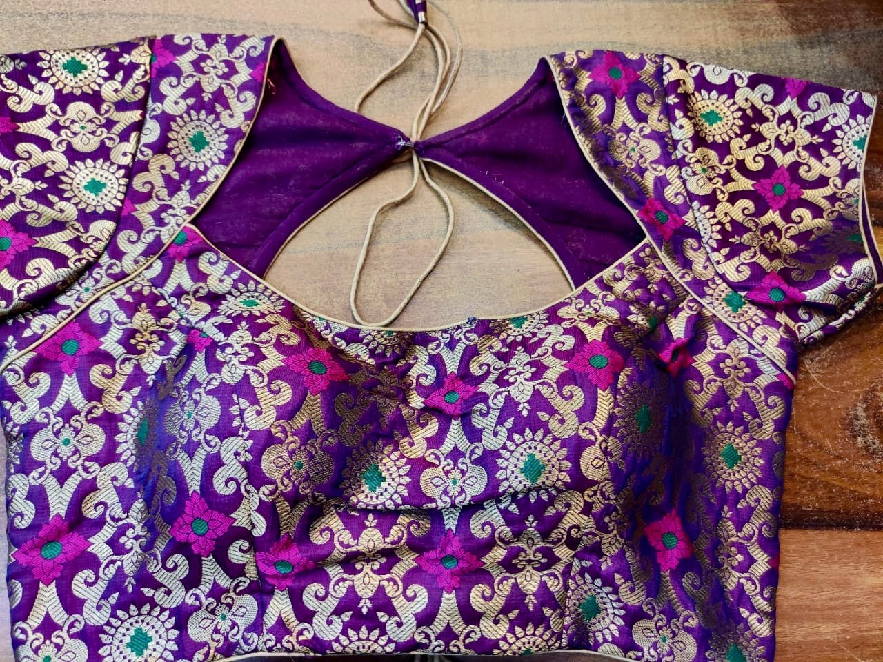 Buy stunning purple Benarasi silk designer saree blouse online in USA. Elevate your ethnic saree style with a tasteful collection of designer saree blouses, embroidered sari blouses, Banarasi blouses, silk saree blouses from Pure Elegance Indian clothing store in USA.-front