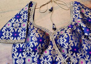 Shop beautiful blue Benarasi silk designer sari blouse online in USA with golden lace. Elevate your ethnic saree style with a tasteful collection of designer saree blouses, embroidered sari blouses, Banarasi blouses, silk saree blouses from Pure Elegance Indian clothing store in USA.-front