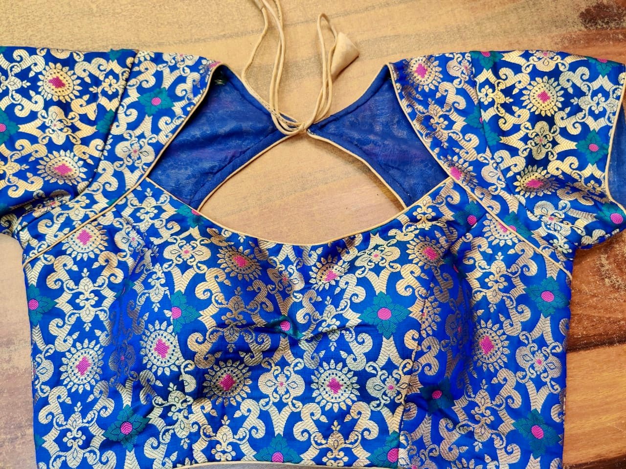 Buy stunning ink blue Banarsi silk designer saree blouse online in USA. Elevate your ethnic saree style with a tasteful collection of designer saree blouses, embroidered sari blouses, Banarasi blouses, silk saree blouses from Pure Elegance Indian clothing store in USA.-front