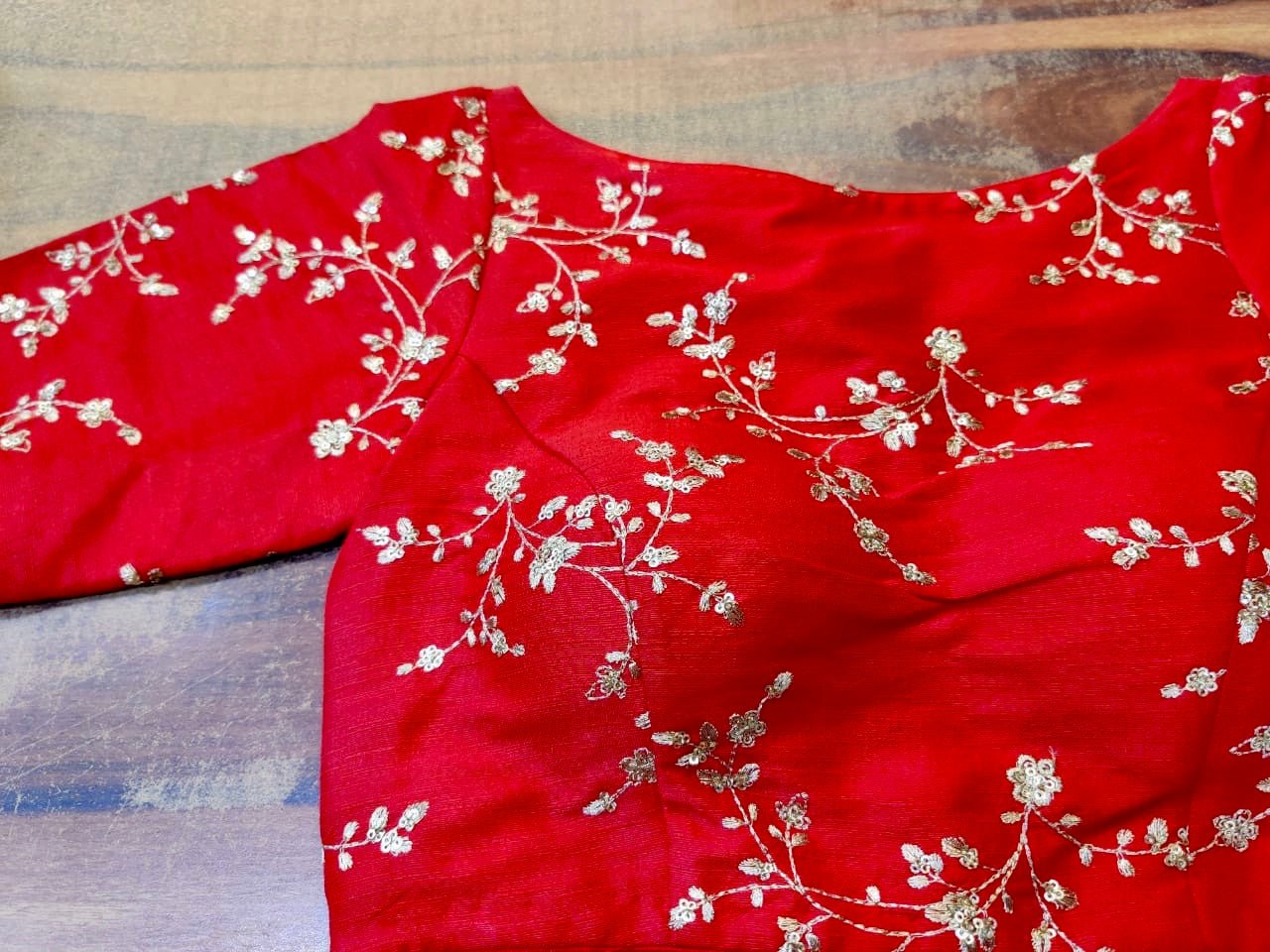 Buy beautiful red designer sari blouse online in USA with golden embroidery. Elevate your ethnic saree style with a tasteful collection of designer sari blouses, embroidered saree blouses, Banarasi blouse, silk sari blouse from Pure Elegance Indian clothing store in USA.-front