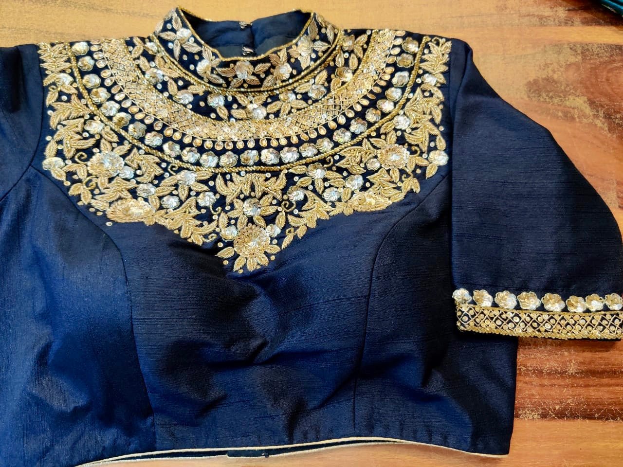 Shop beautiful black designer sari blouse online in USA with heavy embroidery. Elevate your ethnic saree style with a tasteful collection of designer sari blouses, embroidered saree blouses, Banarasi blouse, silk sari blouse from Pure Elegance Indian clothing store in USA.-front