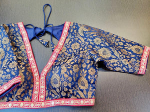 Buy blue designer sari blouse online in USA with pink embroidered lace. Elevate your ethnic saree style with a tasteful collection of designer saree blouses, embroidered saree blouses, Banarasi saree blouse, silk sari blouse from Pure Elegance Indian clothing store in USA.-front