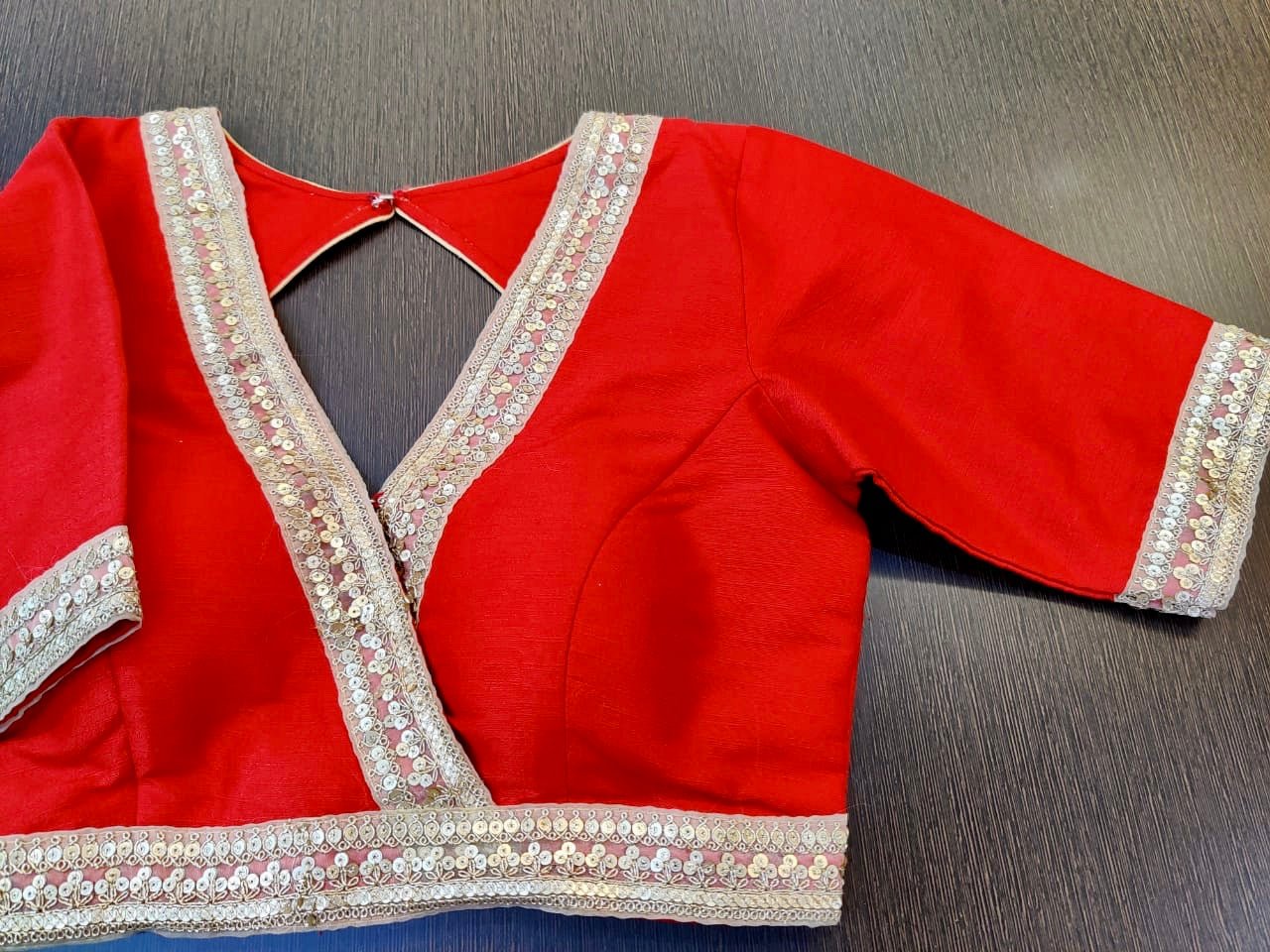 Buy stunning solid red designer saree blouse online in USA with embroidered lace. Elevate your ethnic sari style with a stunning collection of designer saree blouses, embroidered saree blouses, Banarasi sari blouse, silk sari blouse from Pure Elegance Indian clothing store in USA.-full view