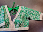 Shop stunning green embroidered designer saree blouse online in USA with silver zari work. Elevate your ethnic sari style with a stunning collection of designer saree blouses, embroidered saree blouses, Banarasi sari blouse, silk sari blouse from Pure Elegance Indian clothing store in USA.-front