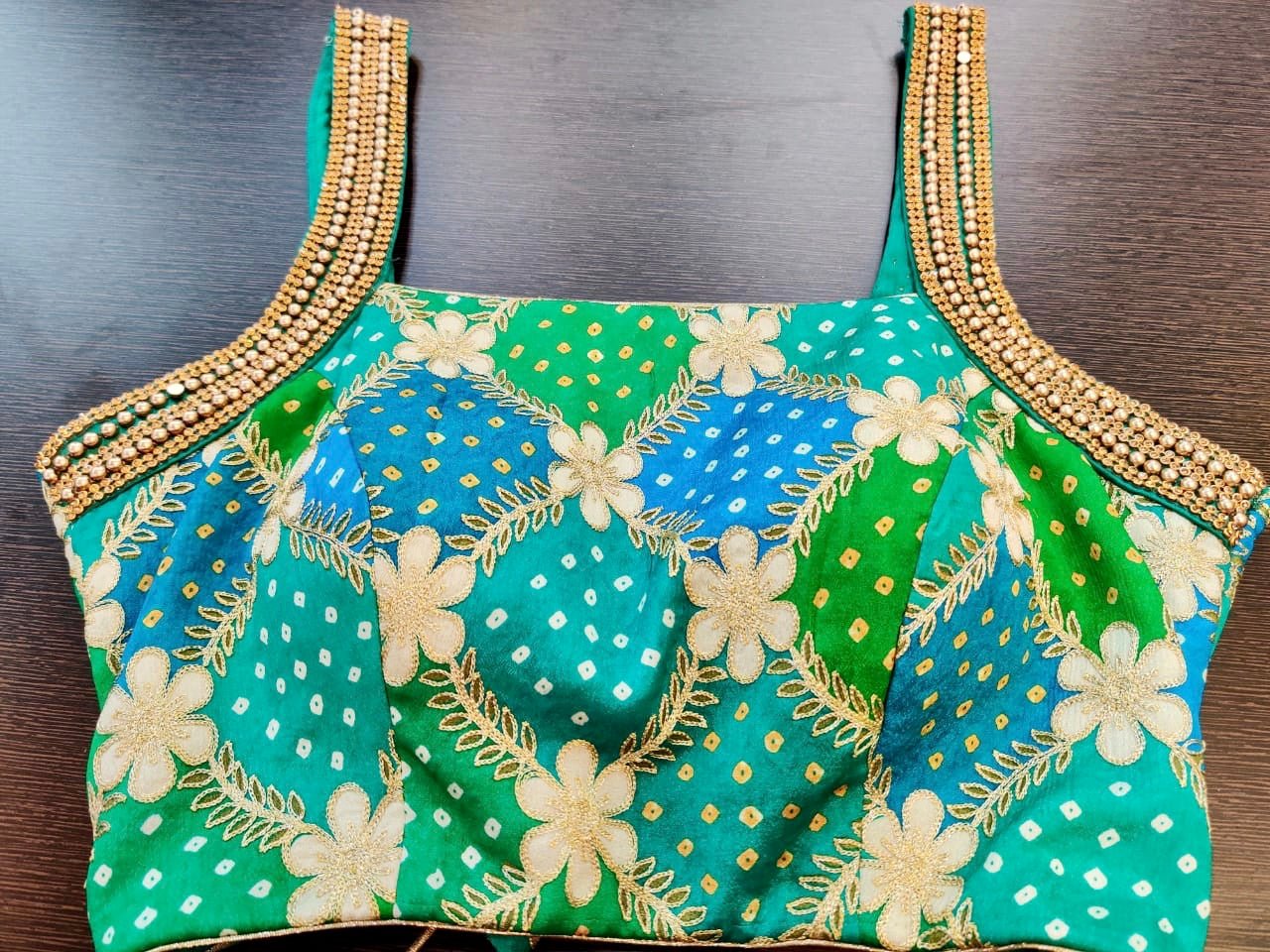 Buy stunning green and blue embroidered Bandhej sari blouse online in USA. Elevate your ethnic sari style with a stunning collection of designer saree blouses, embroidered saree blouses, Banarasi sari blouse, silk sari blouse from Pure Elegance Indian clothing store in USA.-full view