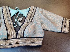 Shop gorgeous powder blue zari work saree blouse online in USA with embroidered lace. Elevate your ethnic sari style with a stunning collection of designer saree blouses, embroidered saree blouses, Banarasi sari blouse, silk sari blouse from Pure Elegance Indian clothing store in USA.-full view