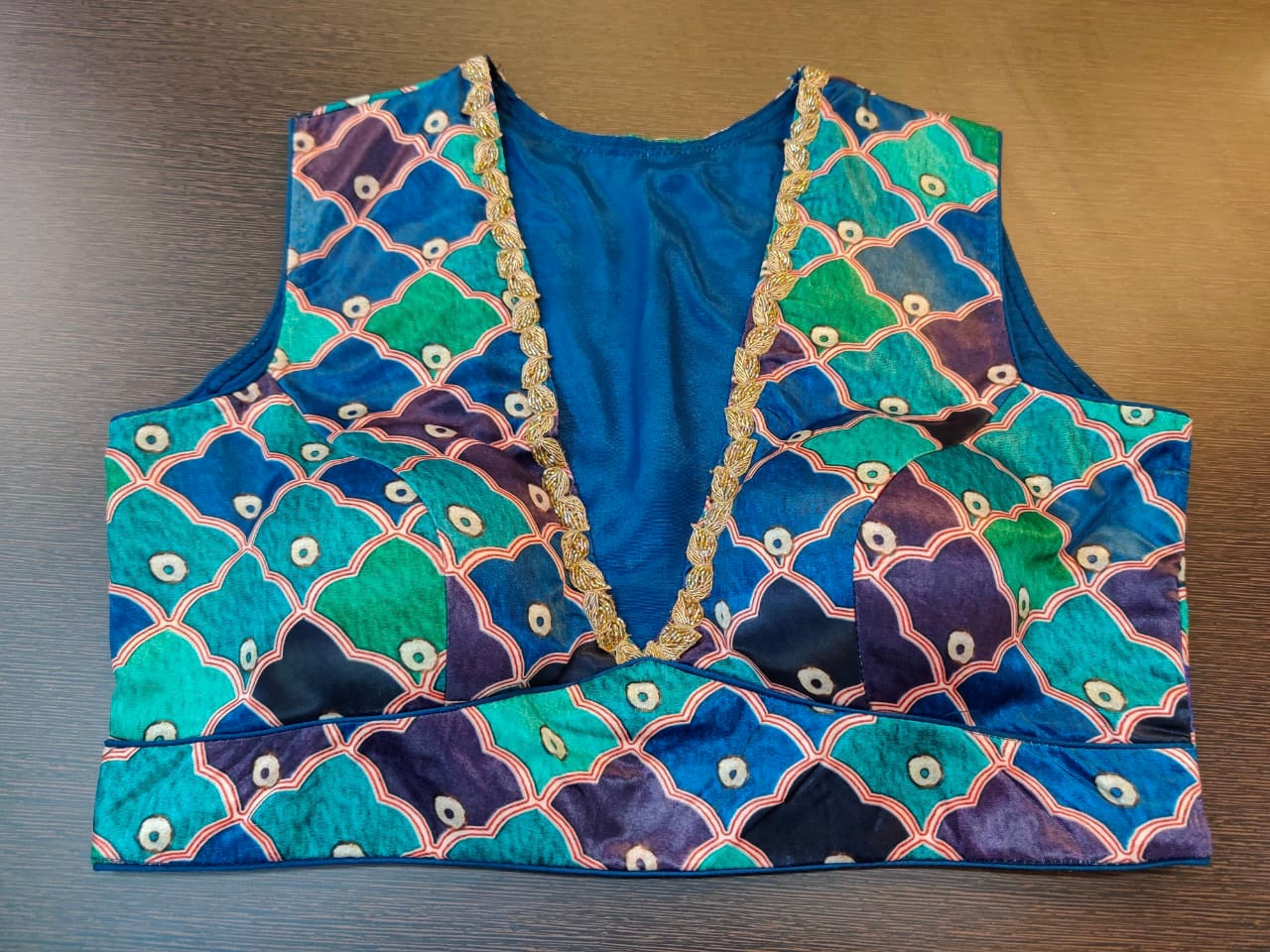 Shop beautiful blue and green designer sari blouse online in USA with embroidered neckline. Elevate your Indian sari style with a stunning collection of designer sari blouses, embroidered saree blouses, Banarasi saree blouse, fancy sari blouse from Pure Elegance Indian clothing store in USA.-front