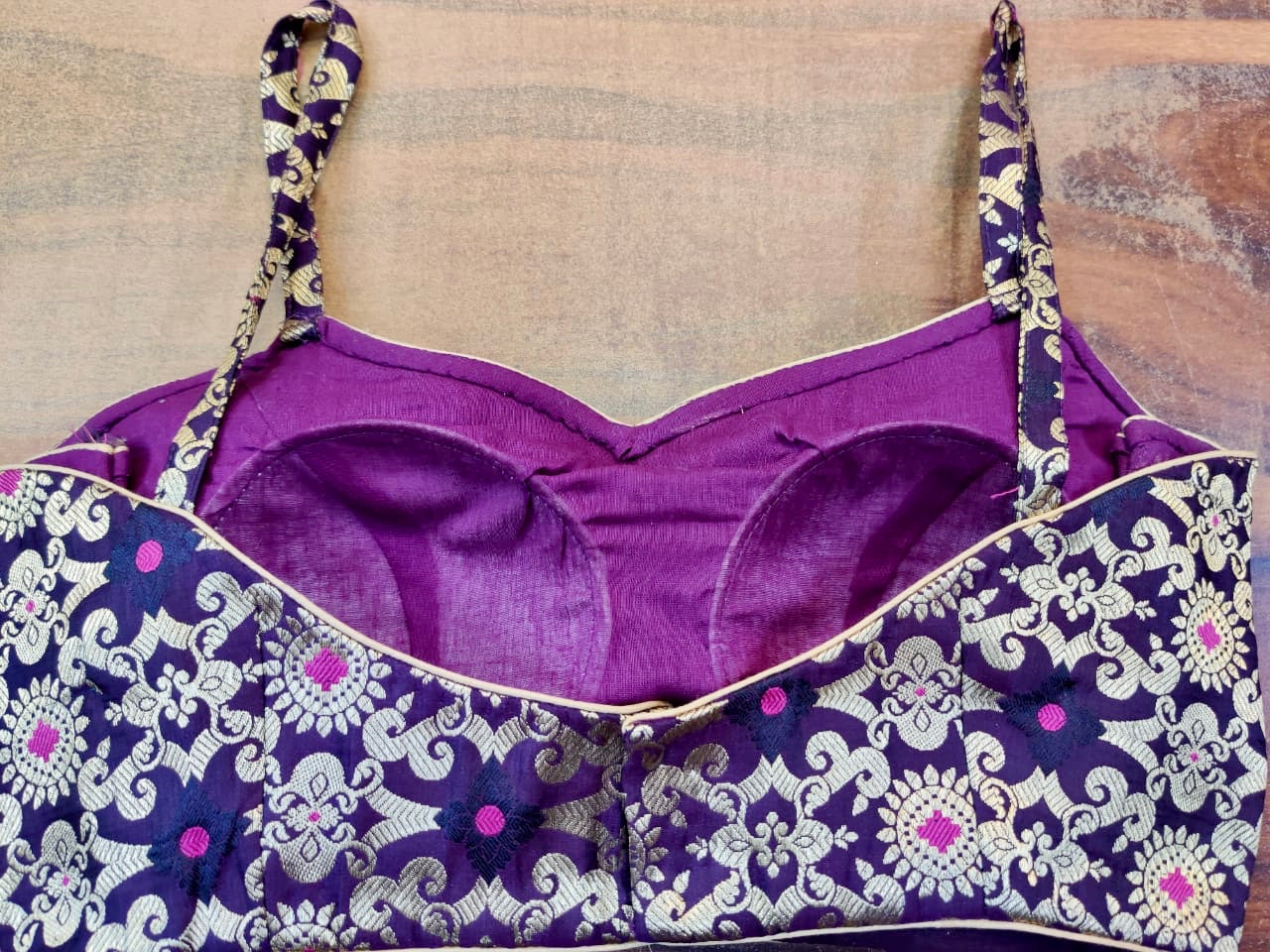 Buy beautiful purple sleeveless Banarasi saree blouse online in USA with zari minakari work. Elevate your traditional sari style with a stunning collection of designer sari blouses, embroidered saree blouses, Banarasi sari blouse, fancy saree blouse from Pure Elegance Indian clothing store in USA.-back