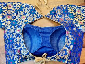 Buy stunning blue Banarsi sari blouse online in USA with zari minakari work. Elevate your Indian saree style with exquisite readymade sari blouses, embroidered saree blouses, Benarasi saree blouse, fancy saree blouse from Pure Elegance Indian clothing store in USA.-back