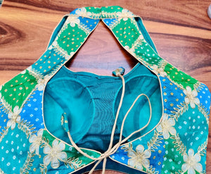 Buy beautiful blue and green embroidered Bandhej halter neck sari blouse online in USA. Elevate your Indian saree style with exquisite readymade sari blouses, embroidered saree blouses, Benarasi saree blouse, fancy saree blouse from Pure Elegance Indian clothing store in USA.-back