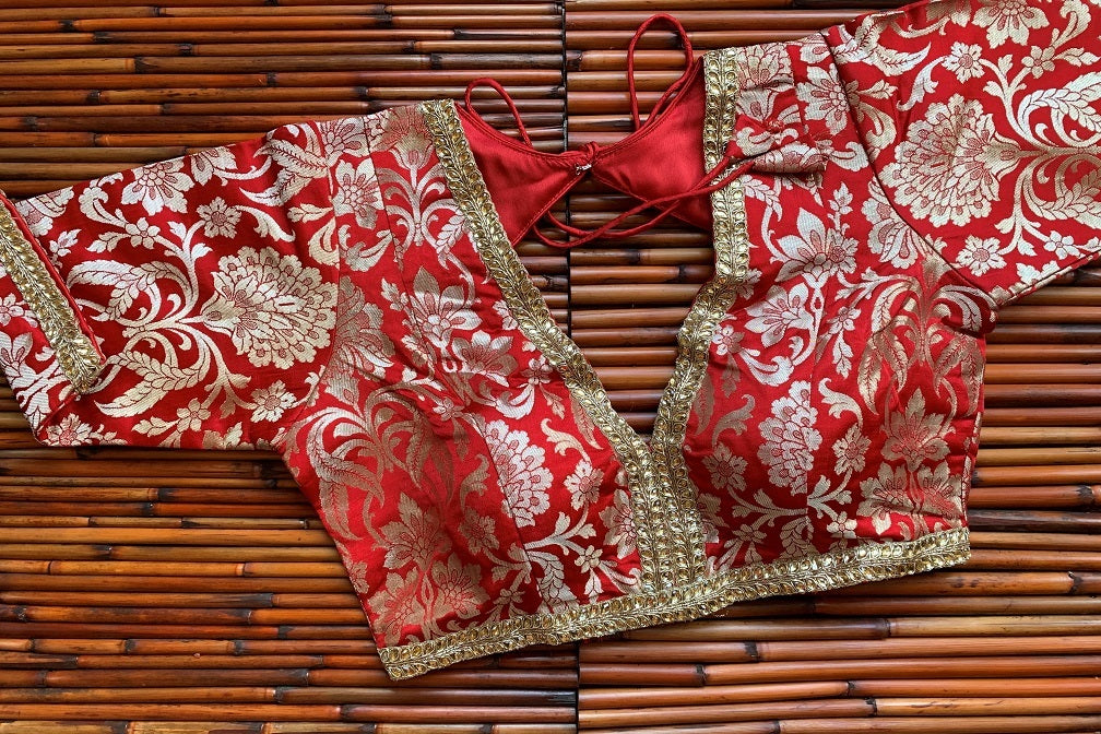 Buy gorgeous red embroidered Banarasi sari blouse online in USA. Elevate your Indian saree style with exquisite readymade sari blouses, embroidered saree blouses, Benarasi saree blouse, fancy saree blouse from Pure Elegance Indian clothing store in USA.-front