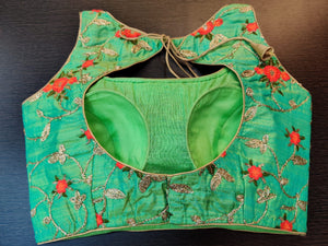 Shop stunning green sleeveless saree blouse online in USA with floral embroidery. Elevate your Indian saree style with exquisite readymade saree blouses, embroidered saree blouses, Benarasi sari blouse, fancy saree blouse from Pure Elegance Indian clothing store in USA.-back