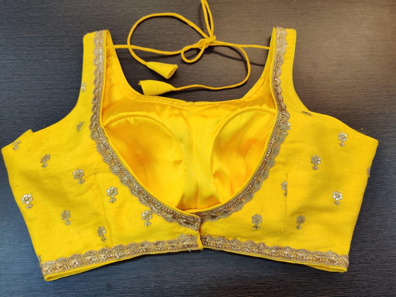 Buy beautiful yellow embroidered designer sleeveless saree blouse online in USA. Elevate your Indian saree style with exquisite readymade saree blouses, embroidered saree blouses, Benarasi saree blouse, fancy saree blouse from Pure Elegance Indian clothing store in USA.-back