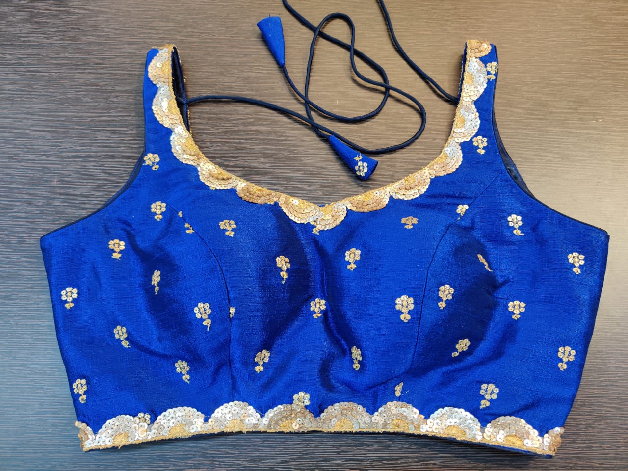 Shop ink blue embroidered sleeveless saree blouse online in USA. Elevate your ethnic sari look with beautiful readymade sari blouses, embroidered saree blouses, Banarasi sari blouse, fancy sari blouse from Pure Elegance Indian clothing store in USA.-front