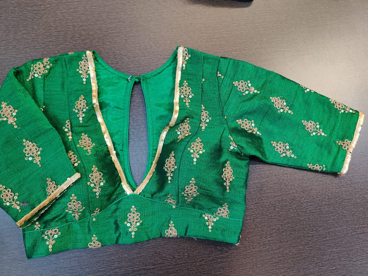 Buy bottle green embroidered designer saree blouse online in USA. Elevate your ethnic sari look with beautiful readymade sari blouses, embroidered saree blouses, Banarasi sari blouse, fancy sari blouse from Pure Elegance Indian clothing store in USA.-front