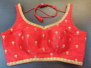Buy stunning red embroidered sleeveless sari blouse online in USA. Elevate your Indian saree style with exquisite readymade saree blouses, embroidered saree blouses, Benarasi saree blouse, fancy saree blouse from Pure Elegance Indian clothing store in USA.-front