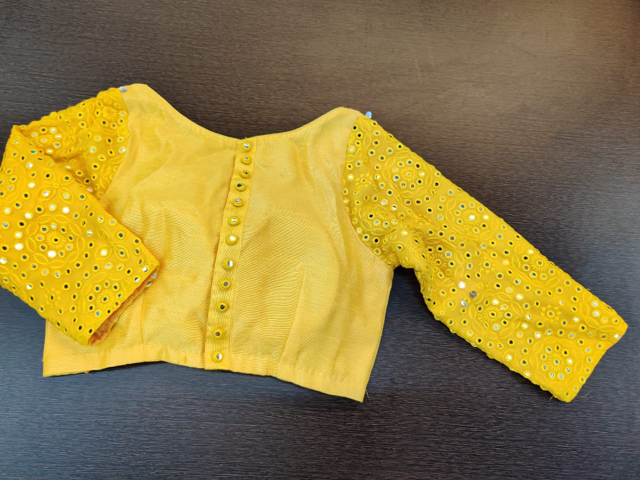 Shop yellow saree blouse online in USA with mirror work sleeves. Elevate your Indian saree style with exquisite readymade saree blouses, embroidered saree blouses, Benarasi saree blouse, fancy saree blouse from Pure Elegance Indian clothing store in USA.-back