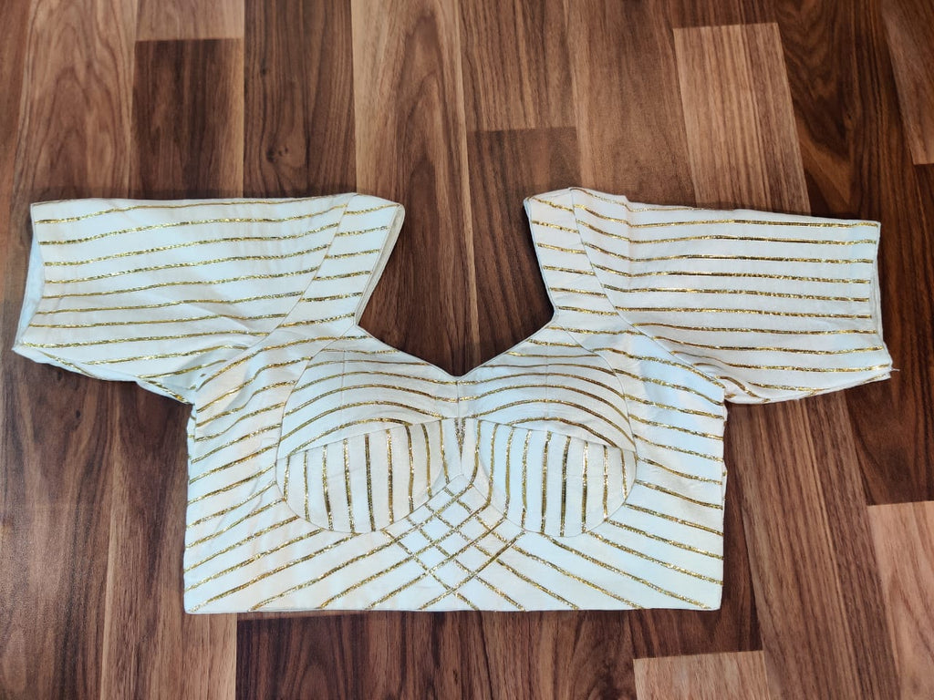 Buy stunning white gota lace saree blouse online in USA. Elevate your Indian saree style with exquisite readymade saree blouses, embroidered saree blouses, Benarasi saree blouse, fancy saree blouse from Pure Elegance Indian clothing store in USA.-full view