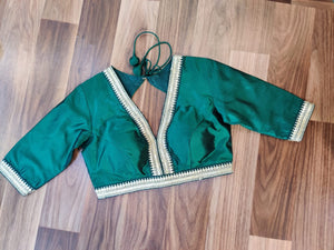 Shop dark green embroidered designer sari blouse online in USA. Elevate your Indian saree style with exquisite readymade saree blouses, embroidered saree blouses, Benarasi saree blouse, fancy saree blouse from Pure Elegance Indian clothing store in USA.-front